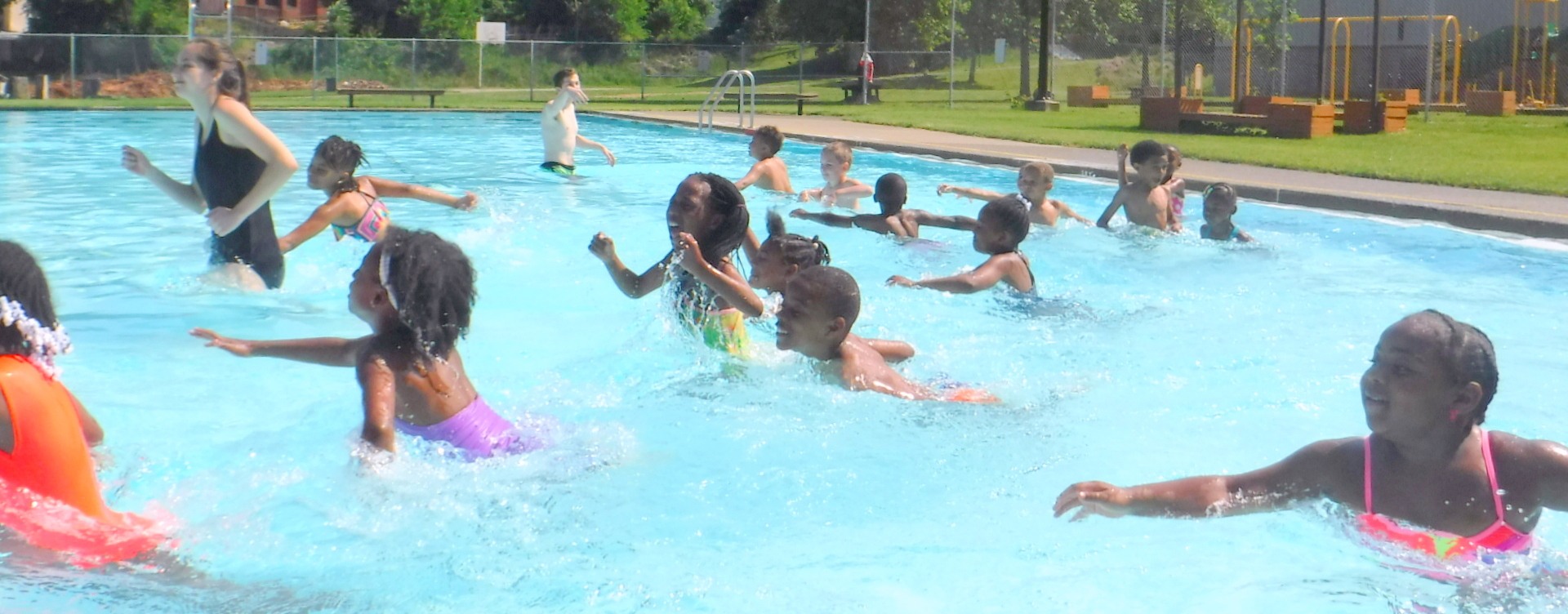Kids running in the swim pool at The Pittsburgh Project